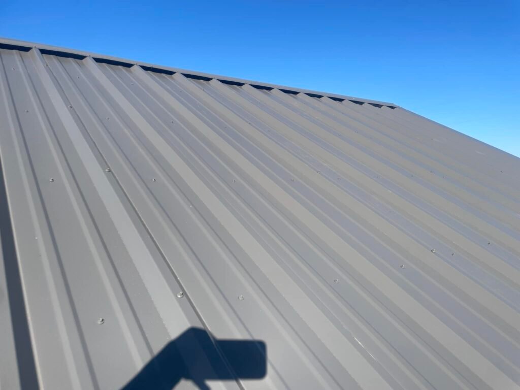 close-up of metal roofing panels with exposed fasteners on a roof in Abilene, TX